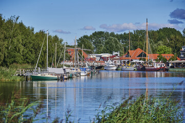 Poster - GREIFSWALD, GERMANY - Aug 31, 2020: Sailing idyll at Greifswald harbor in Germany.