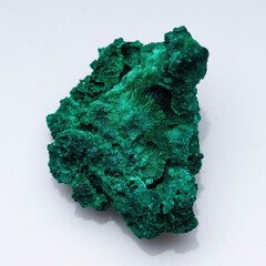 Malachite green ore on a white background. Natural green malachite