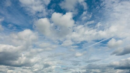 Wall Mural - Clouds flying against blue sky at sunny day, quality full hd time lapse.