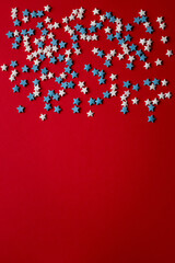 red christmas background with white and blue stars