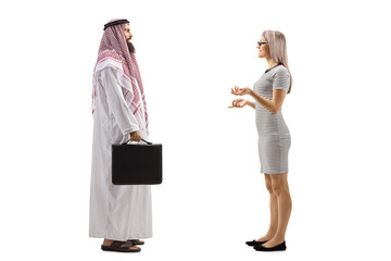 Canvas Print - Saudi arab man with a briefcase and a young blond woman having a conversation