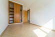 © Joao - Empty room with dark wooden floating laminate flooring and wardrobe. House interior, wide bedroom space. Newly recently painted new apartment or house. Wood floor. Real state and property management