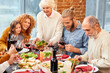 Happy family celebrating holiday with healthy vegan dinner