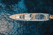 © AmazingAerialAgency - Aerial view of yacht in blue sea with helipad, Saint Tropez, France.