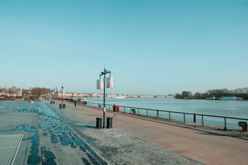 Sticker - BORDEAUX, FRANCE - Oct 28, 2020: Beautiful landscape shot of the Bordeaux river and people walking