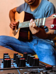 Sticker - Vertical shot of a male playing on guitar