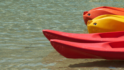 Sticker - Closeup of bows of kayaks on the river