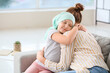 © Pixel-Shot - Little girl after chemotherapy with her mother at home