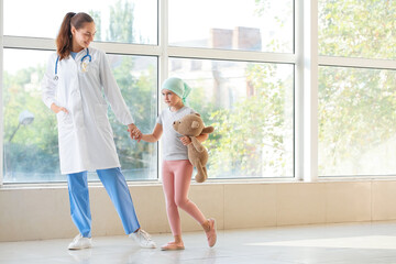 Sticker - Doctor and little girl in clinic. Childhood cancer awareness concept