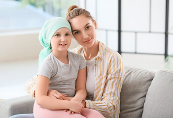 Sticker - Little girl after chemotherapy with her mother at home