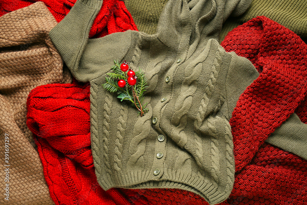 Warm winter clothes with Christmas decor, top view