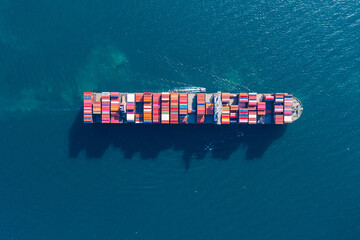 Wall Mural - Cargo container in factory harbor at industrial estate for import export around in the world, Trade Port / Shipping - cargo to harbor. Aerial view of sea freight, Cargo ship,  