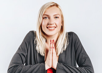 Beautiful happy young girl smiles on gray isolated background