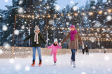 christmas, family and leisure concept - happy mother, father and daughter at outdoor skating rink in winter over snow