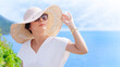© myboys.me - Beautiful & Stylish Asian woman wearing straw beach hat and 100% UV protection sunglasses to protect her eyes and face from sun exposure. Skin aging, Optical, Ultraviolet keratitis, Beauty products.