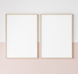 two wooden frames on pink and white wall, frame mockup, 3d render	