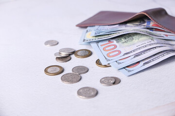 Close up of cash in wallet on table.