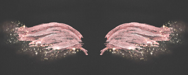 Glittering abstract pink hand painted wings on black background