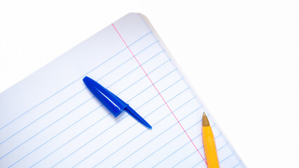 Wall Mural - a yellow pen with a blue open cap lying on a notebook in line.