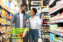 African Family Couple Shopping In Supermarket Buying Groceries Indoor