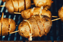 Unpeeled Potatoes With Bacon On The Grill