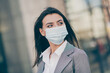 Photo of minded pretty businesswoman wear medical mask formalwear jacket employee in quarantine in outdoors