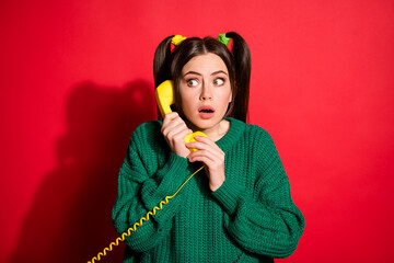 Poster - Photo of young scared worried shocked girl talk telephone look copyspace isolated on red color background