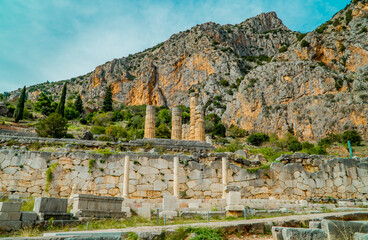 Wall Mural - Ruins of the Stoa of Athenians at the ancient ruin site of Delphi, Greece with mountains in the background