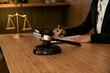 © Charlie's - Legal counsel presents to the client a signed contract with gavel and legal law. justice and lawyer concept.