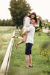 © Andriy Medvediuk - beautiful young couple hugging and having fun outdoors in the park on a warm summer sunny day