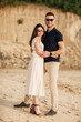© Andriy Medvediuk - Happy lovers at the beach near lake. Young couple is hugging at sunset on summer day outdoors. A man and woman in love. Concept of love and family. full length. Close Up.