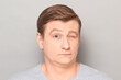 © Andrei Korzhyts - Portrait of funny mature man winking with one eyebrow raised