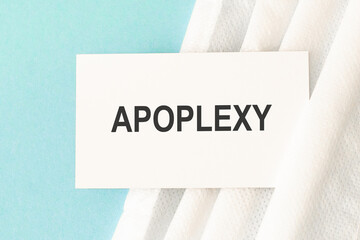 Word apoplexy with medical mask on a blue background.