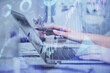 © peshkova - Multi exposure of woman hands typing on computer and financial graph hologram drawing. Stock market analysis concept.
