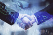 © peshkova - Double exposure of forex graph hologram and handshake of two men. Stock market concept.
