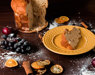 Wall Mural - Delicious christmas cake panettone slice and Christmas decorations.