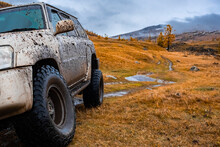 Dirty Offroad Suv In Autumn. Offroad Journey Trip Concept. Overlanding, Travel In Autumn Concept. 23.09.2020 Katon, Kazakhstan.