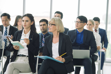 Multi ethnic business audience listening to presentation at conference,Business and entrepreneurship concept.