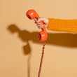 © Rawpixel.com - Woman answering a corded retro phone