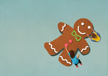 Boy And Girl Assembling Gingerbread Man
