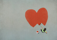 Woman Painting Red Heart With Paint Roller
