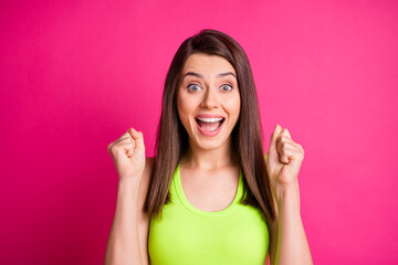 Poster - Photo of hooray pretty young long hairdo woman hands fists yell dress lime top isolated on vibrant pink background