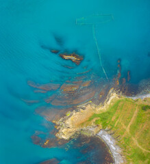 Aerial view of picturesque coastline with beautiful cliffs, surrounded by clear blue sea water, Black sea coast, Bulgaria 