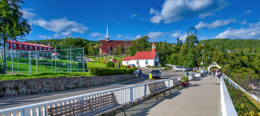 Sticker - TADOUSSAC, CANADA - AUGUST 2008: Waterfront with tourists on a beautiful summer day