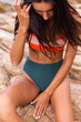 © Анастасия Каргаполов - Close shot of womans fit core with abs in bikini on beach. Fitness motivation, losing weight, perfect body.