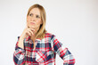© Danko - Young woman in casual clothes standing over white isolated background clueless and confused expression. Doubt concept.
