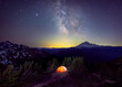 © Cavan Images - A tent is under the Milky Way on the top of a mountain, Washington, US