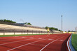 © Cavan Images - young boy in sportswear trains running on red soil