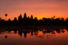 Angkor Wat, Siem Reap, Cambodia. Sunrise From Reflection Pool Showing 5 Towers Of Main Temple.