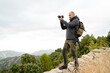 © Cavan Images - caucasian man Traveler with photo camera and backpack